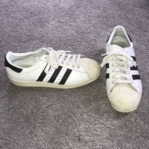 Adidas custom sneaker with black snakeskin stripes